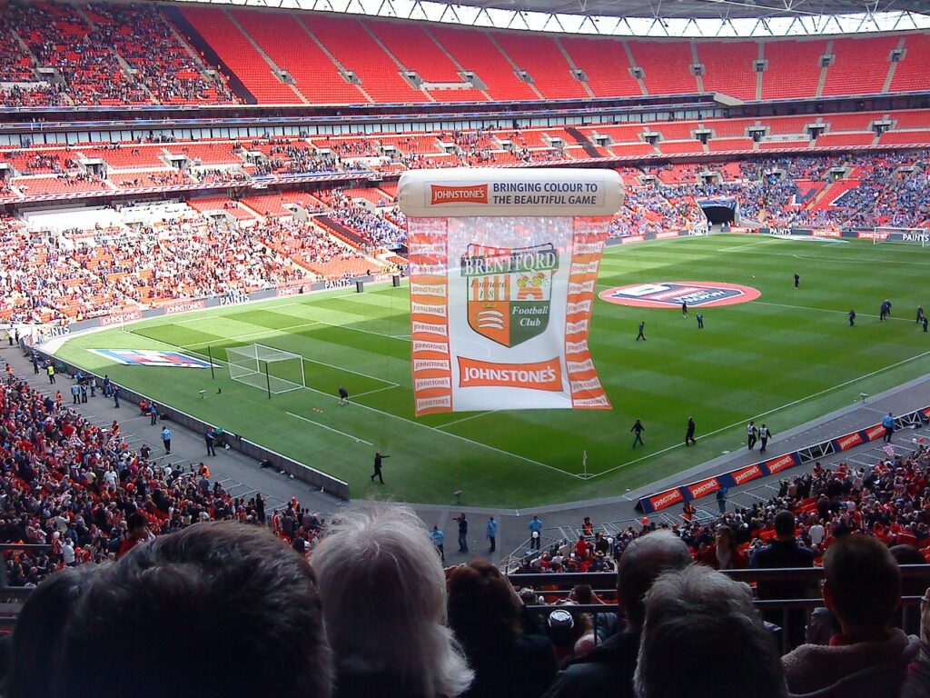 Behind the Scenes at Wembley: A Journey Through England’s Iconic Stadium Few venues in the world carry the prestige and history of Wembley Stadium. Nestled in the heart of London, Wembley is more than just a football stadium—it is a cultural landmark, a symbol of sporting excellence, and a stage for unforgettable performances. The Wembley Stadium Tour offers fans and visitors an exclusive opportunity to step behind the scenes and explore the history, architecture, and stories that make Wembley an enduring icon of England.